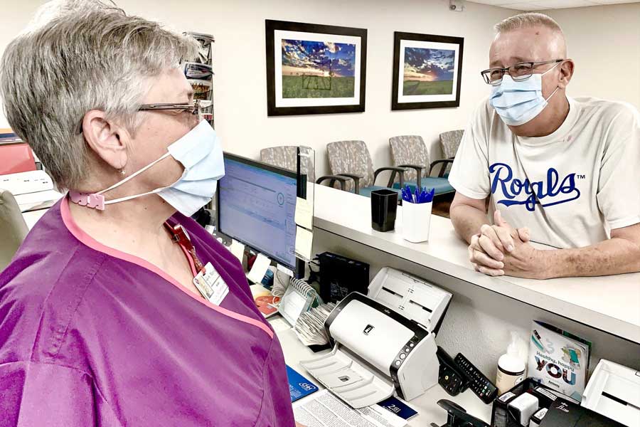 Rodney Tabor with Shari Ard, receptionist at St. Mary's Regional Medical Center Cancer Center.