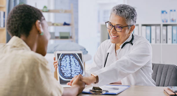 doctor showing patient a brain scan