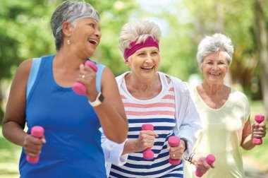 Group of older women exercising outdoors