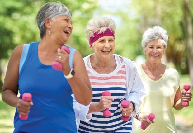 Group of older women exercising outdoors