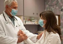 Doctor comforting patient 
