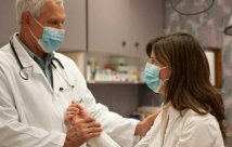 Doctor comforting patient 